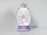 A purple and silver Crown Glitter Globe snow globe from Princess Collection, featuring a glitter-filled interior with a princess figurine and a small orange cat, set against a light gray background with product text overlay.