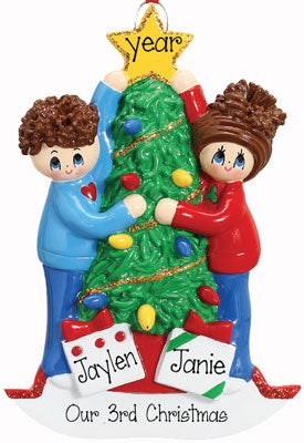 COUPLE DECORATING CHRISTMAS TREE Ornament